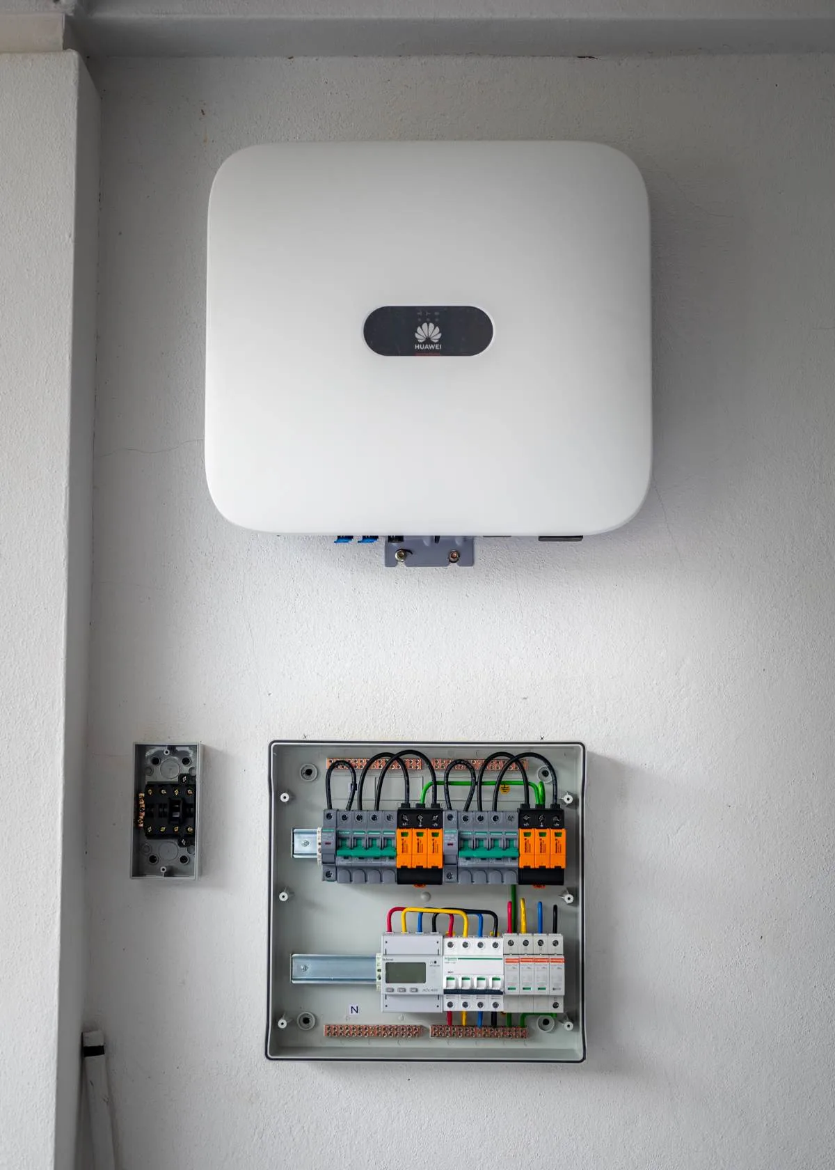 Huawei inverter mounted above the PV distribution box